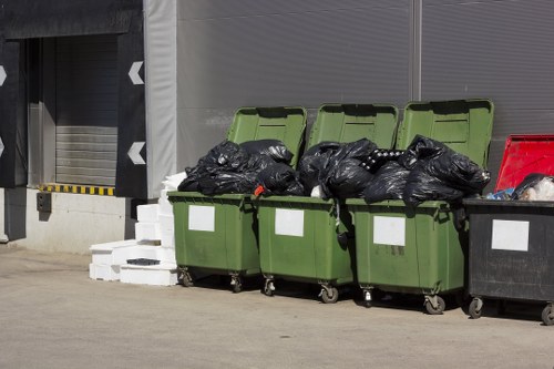 Garden cleanup process by experts in Brent Cross